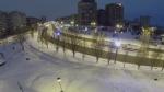 samara tram rides by street at winter night in snowbound city aerial view