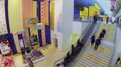samara by stairs and ride on escalator in store ikea aerial