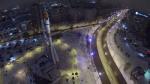samara street traffic near monument of rocket at winter evening aerial view